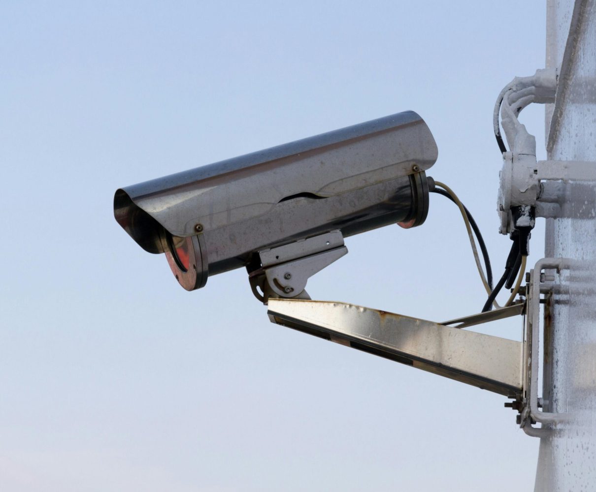 pexels photo 207574 207574 Close-up of an outdoor CCTV camera installed on a wall for security purposes.